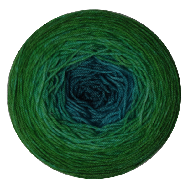 A yarn cake in a gradient from deep aqua in the center to sea green on the outside.