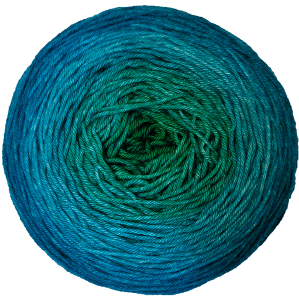 A yarn cake in a gradient from sea green in the center to deep aqua on the outside.