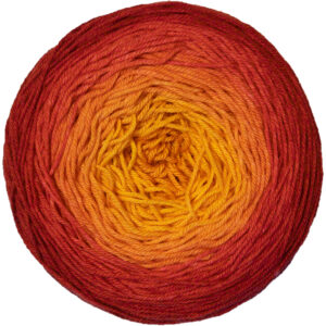 A yarn cake in a gradient from radiant yellow in the center to fiery red on the outside.