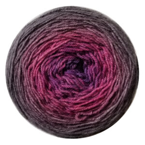 A yarn cake in a gradient from mythical purple in the center to moonless night on the outside.