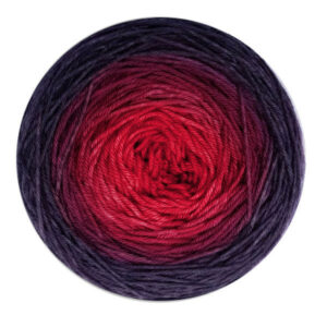 A yarn cake in a gradient from blood red in the center to deep in the shadows grey on the outside.